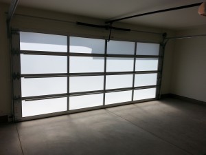 Garage door after decorative film was applied